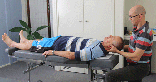 Our Warner Chiropractor Dr David Malone adjusting a client